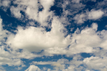 Fototapeta premium Wispy White Clouds Against Dark Blue Sky