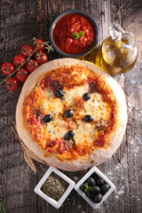 pizza and ingredient on wood