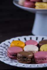 Colorful macaroons on serving plate
