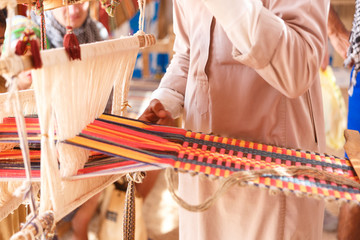 Obraz premium Man produces the fabric