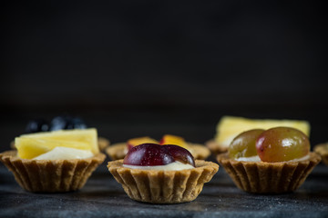 Mini pastry tartlets with fresh fruits