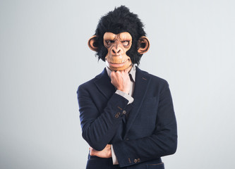 Monkey man thinking over white background
