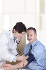 Doctor measures the blood pressure in patients
