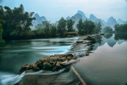 Li River at dawn with karst mountains in the background, Guilin, Guangxi, China