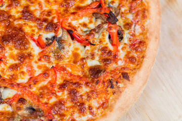 round hot pizza close up top view