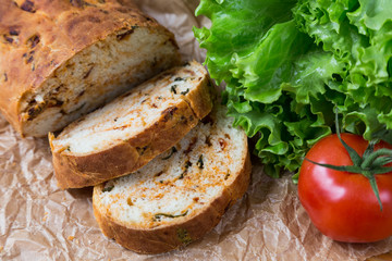 white sliced homemade baguette with dried tomatoes