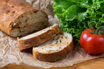 white sliced homemade baguette with dried tomatoes