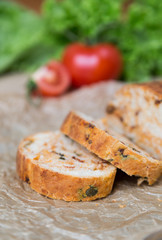 white sliced homemade baguette with dried tomatoes