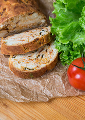 white sliced homemade baguette with dried tomatoes