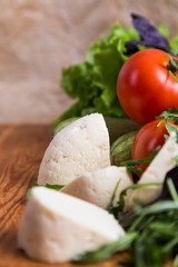 background from mixed vegetables with wood board