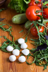 background from mixed vegetables with wood board