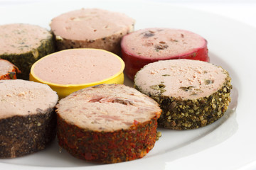 Portions of round pates on plate. Detail.