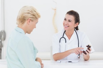 Fototapeta na wymiar Doctor explaining treatment to her patient 