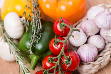 group fresh colored vegetables on wooden