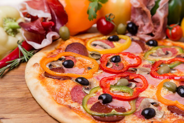 hot pizza with garnish and components