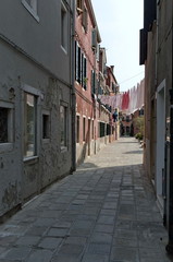 Narrow street in Murano island, Italy