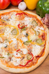 hot pizza with garnish and components