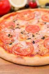 hot pizza with garnish and components