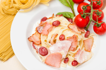 hot pasta with garnish on plate