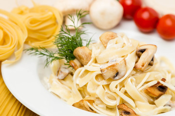 hot pasta with garnish on plate