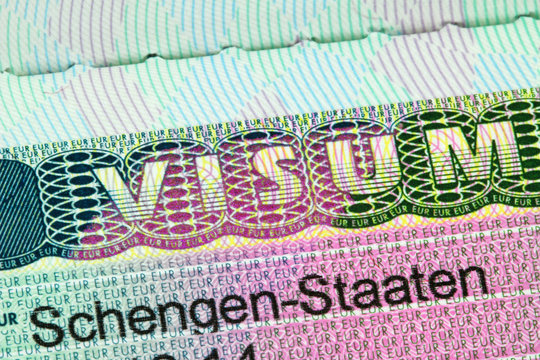 Closeup of the Schengen visa to Austria, Germany with shallow DOF, focusing on the word VISUM 