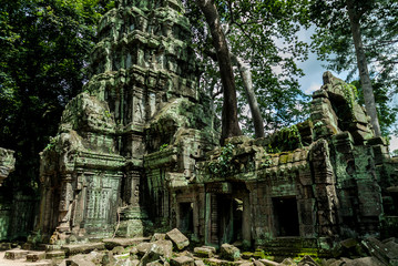 temple detail or prasat ruined with bas-reliefs in the archaeological ta prohm place in siam reap, cambodia