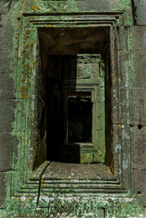 windows of a temple in the archaeological ta prohm place in siam reap, cambodia