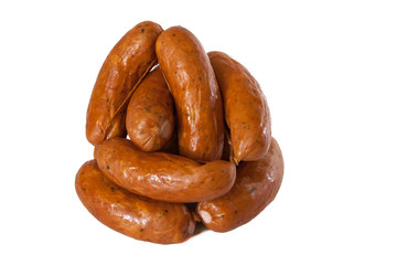 pile meat flavour sausages on white
