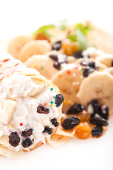 Rolled pancakes with sweet cream and fruits