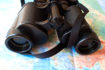 binoculars and map