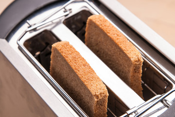 two hot bread toast in toaster