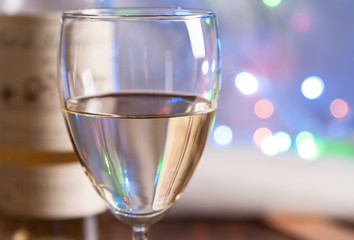 glass and bottle white wine on blink light