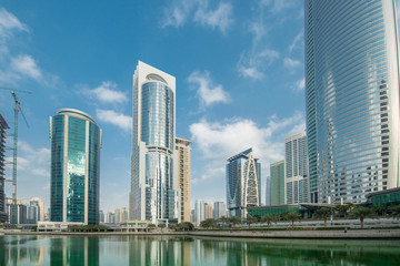 Fototapeta na wymiar Tall skyscrapers in Dubai near water