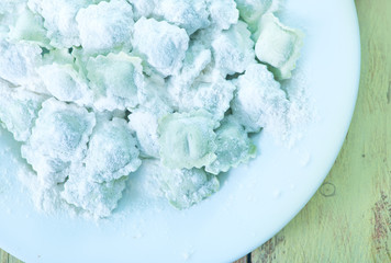 flour and raw ravioli