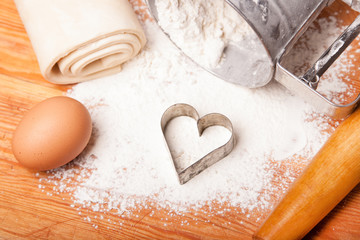 pastry, rolling pin, eggs and figures for cookies