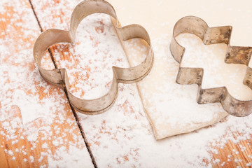 pastry and figures for cookies on wooden