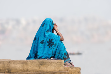 Woman in blue sari at varanasi