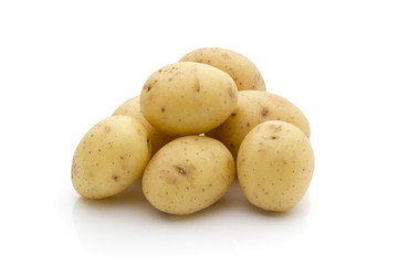 Potatoes on the white background.  New harvest.