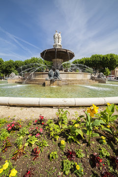 Fountain at La Rotonde with flowers in Aix-en-Provence