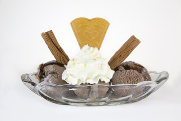 Chocolate ice cream in a glass dish isolated on a white backgrou