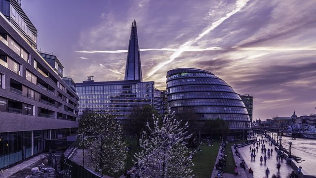 London, Timelapse view of the city hall at dusk after sunset, with dramatic clouds in the sky