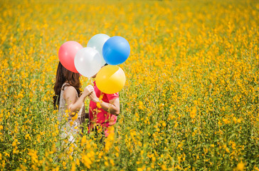 Couple kissing in the garden yellow flowers