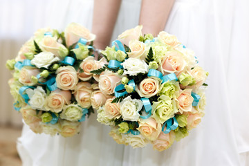 The bride at a wedding holding a bouquet of flowers.
