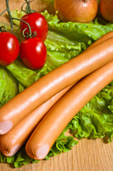sausage on green lettuce