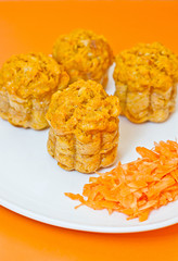 muffins with carrot on orange