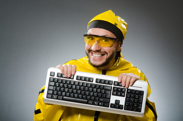 Man wearing yellow suit with keyboard