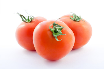 three tomato on white