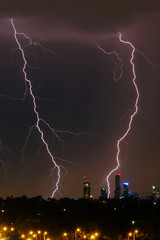 Lightning over city skyline