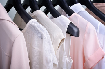 womens clothing pastel colors hanging on the hanger verticalclot