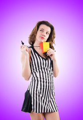 Woman referee with card against the gradient
